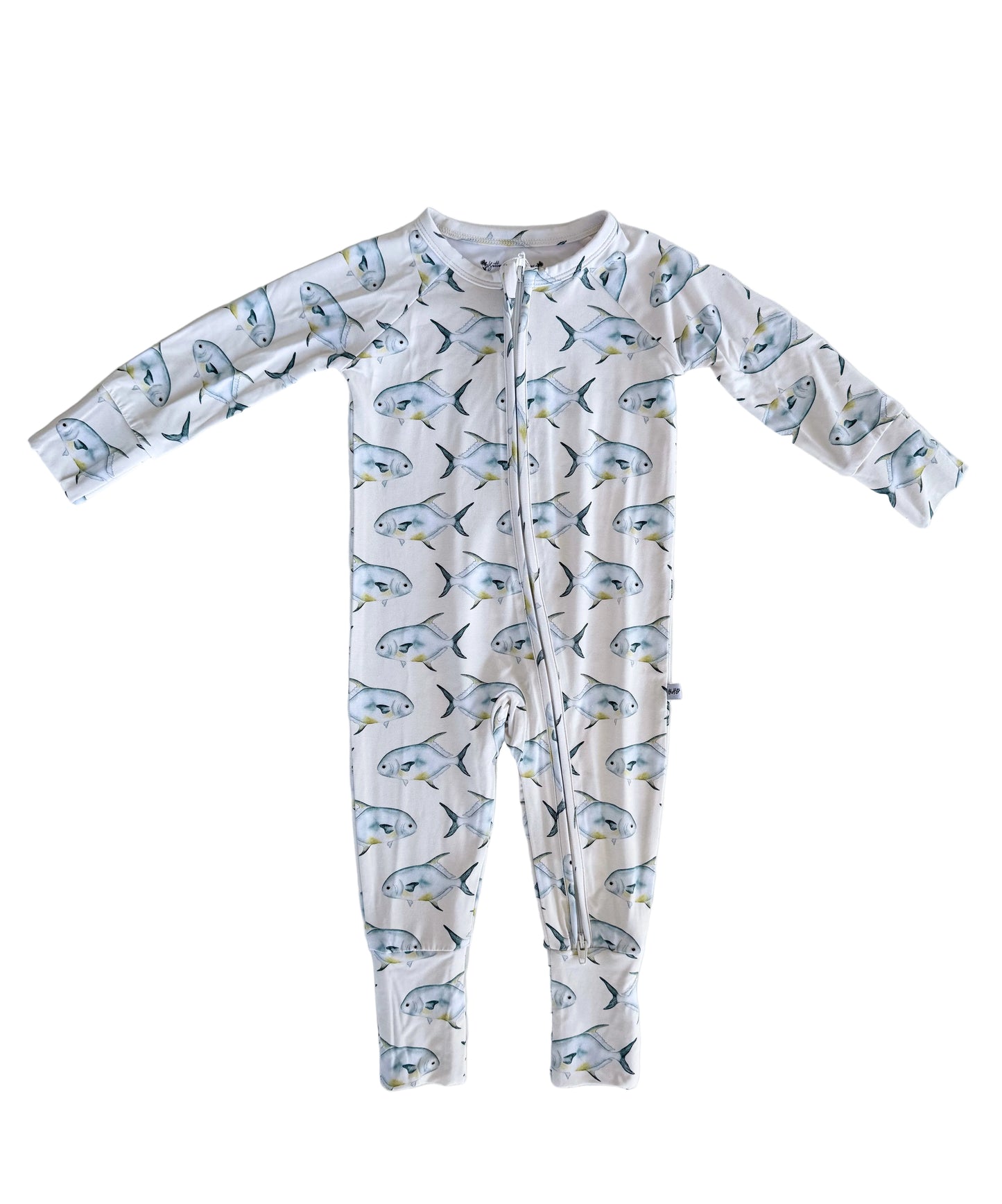 Baby zippy pajama onesie with permit pattern on a light-yellow background