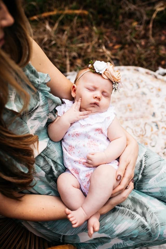 Picture of a mother holding a new baby girl