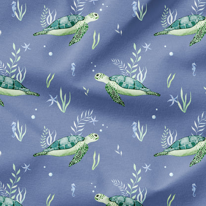 Pattern of green sea turtles and underwater plants on a blue background