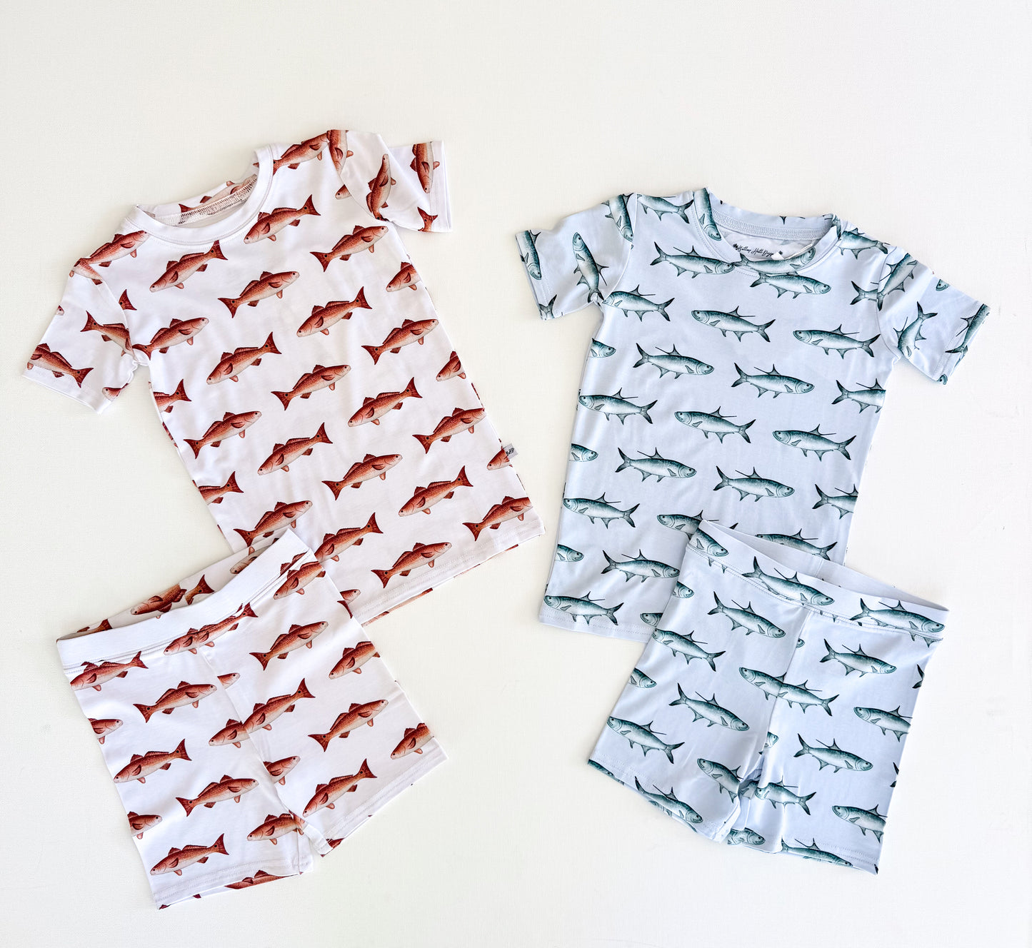 White two-piece short sleeve and Shorts, pajamas with red fish and light blue shorts and short sleeve pajamas with tarpon