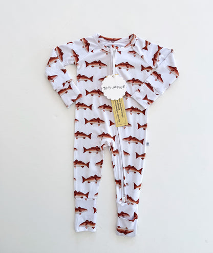 Baby onesie with a redfish pattern on a white background