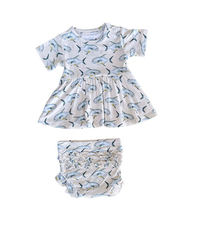 Baby peplum and ruffle bloomers with Permit pattern on a light yellow background