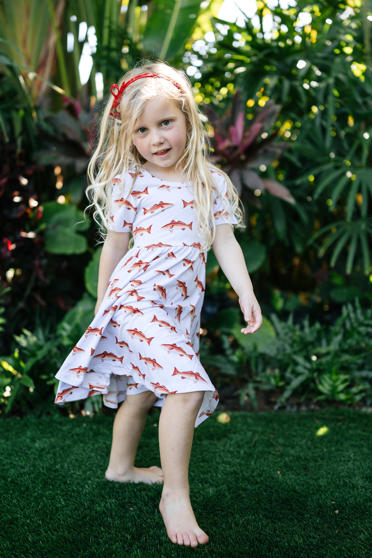 young girl dancing in the redfish seaside dress