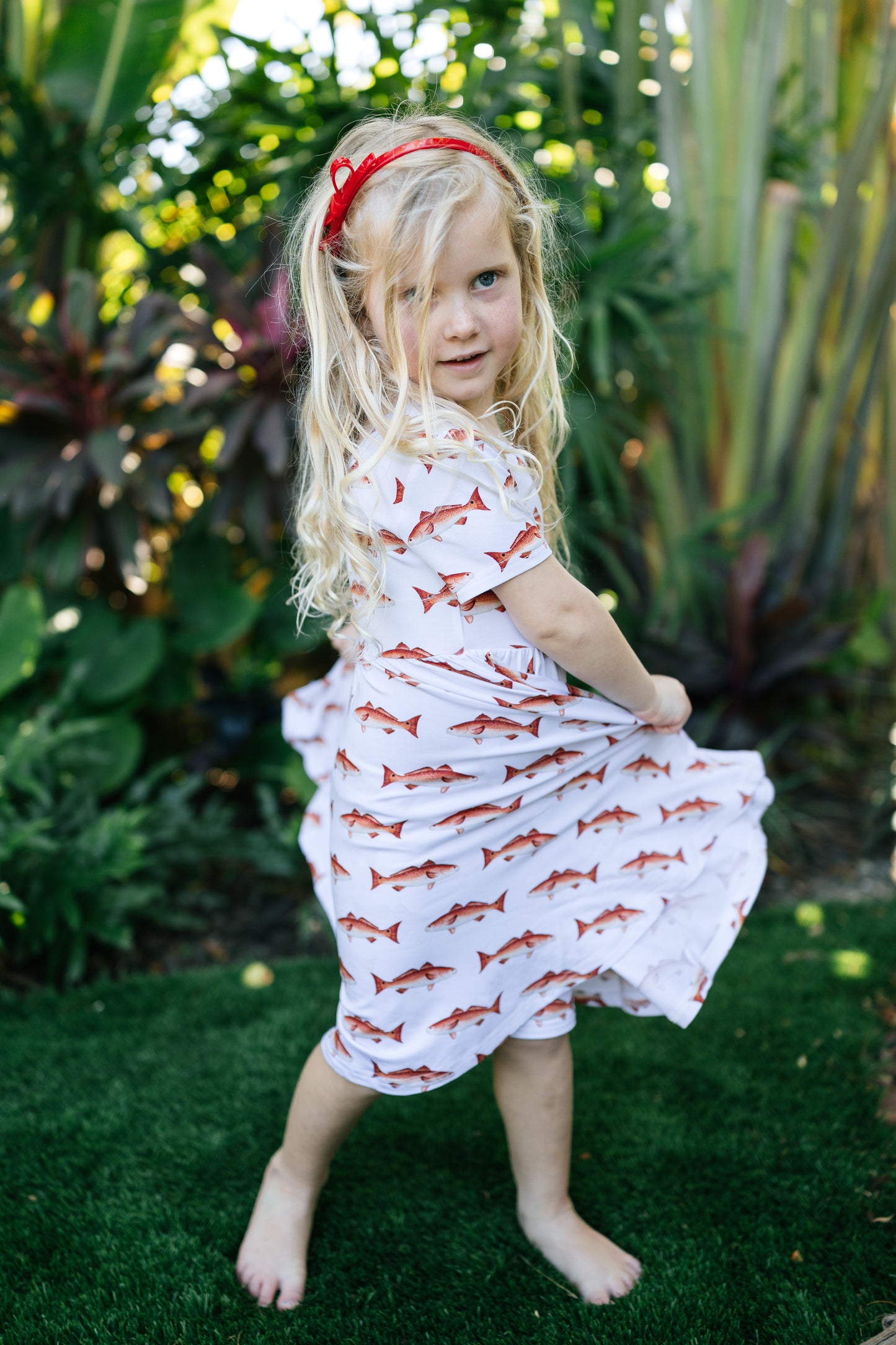 young girl dancing in the redfish seaside dress
