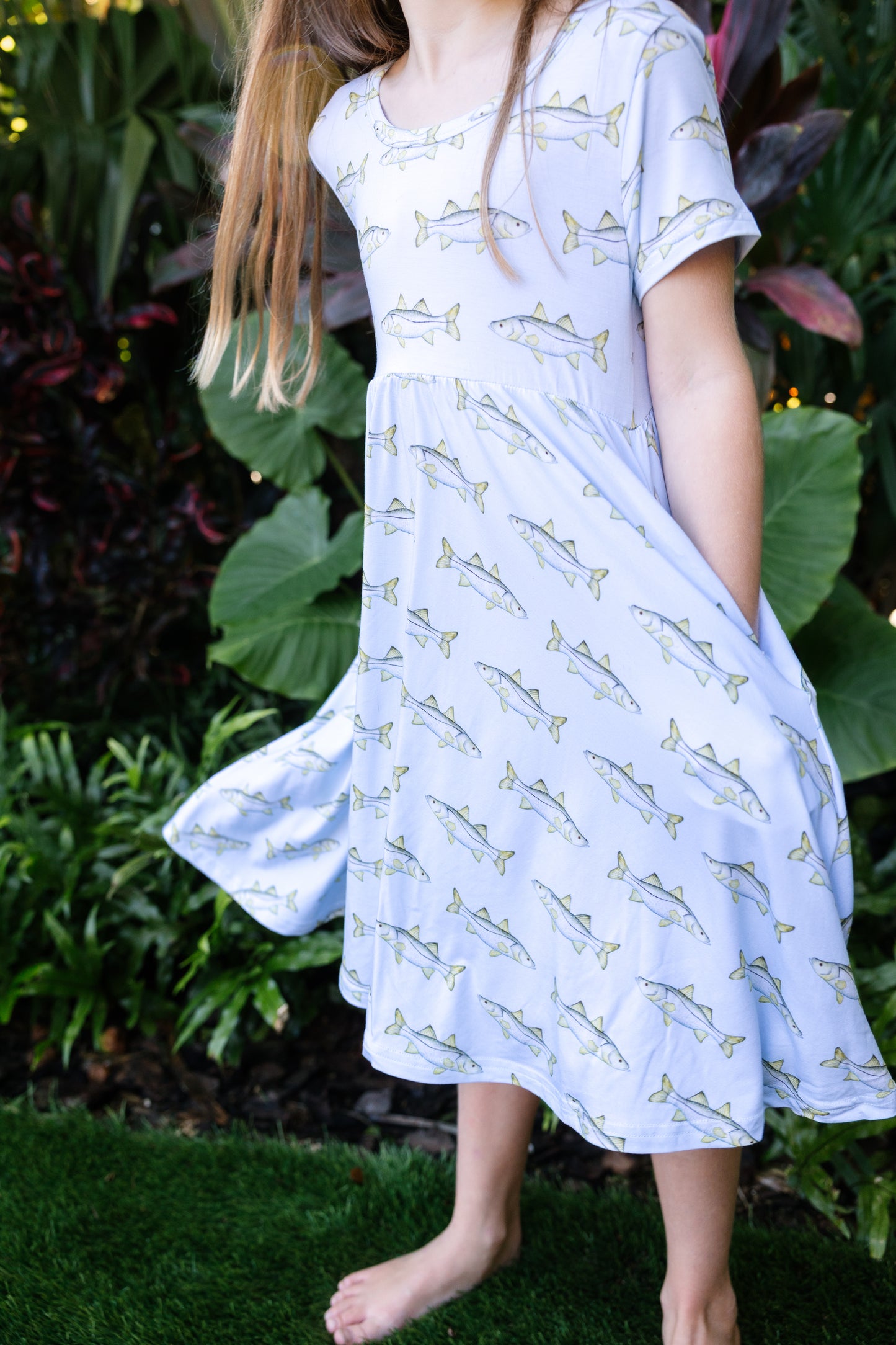 closeup of little girl wearing snook seaside dress