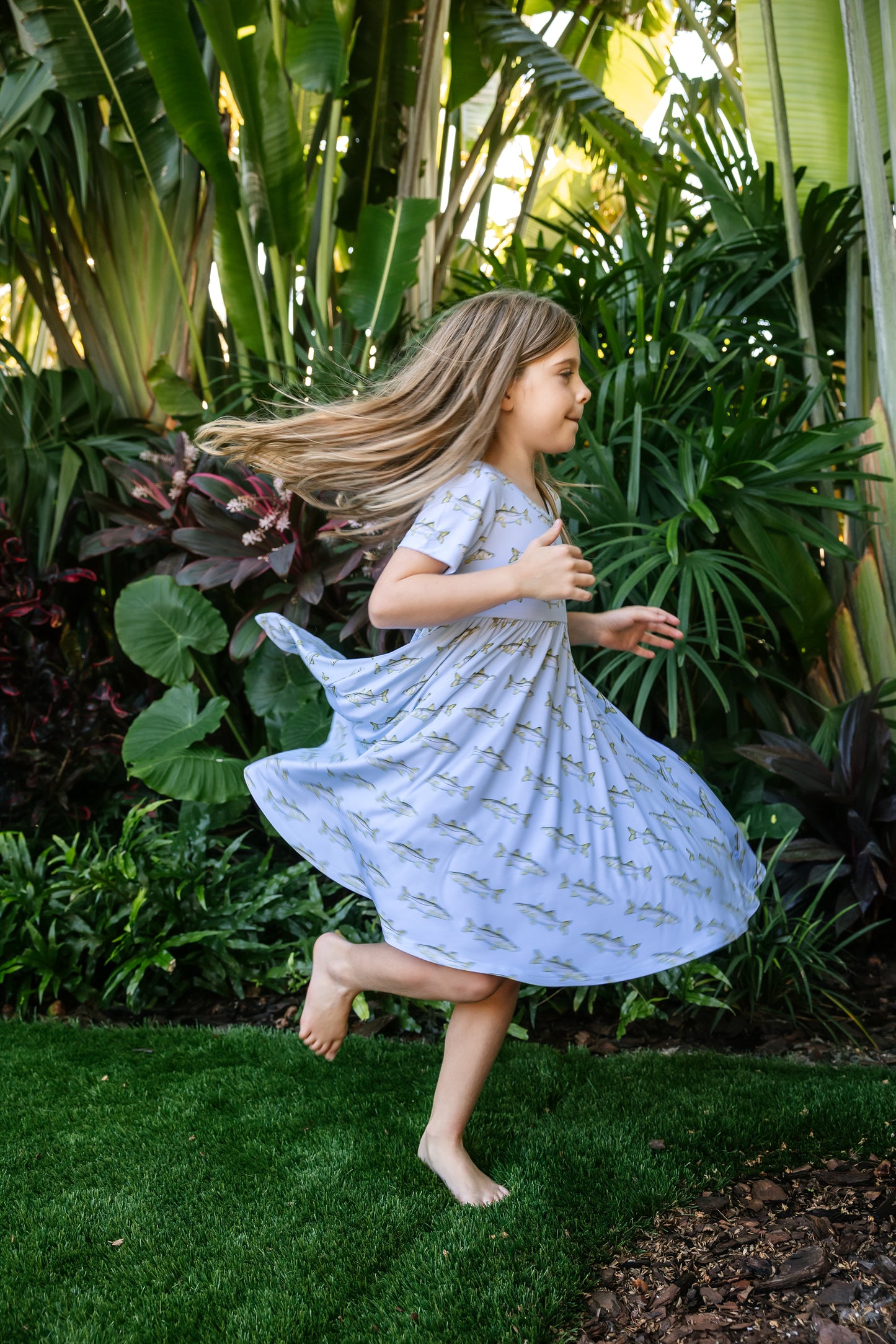 Little girl twirling in snook seaside dress