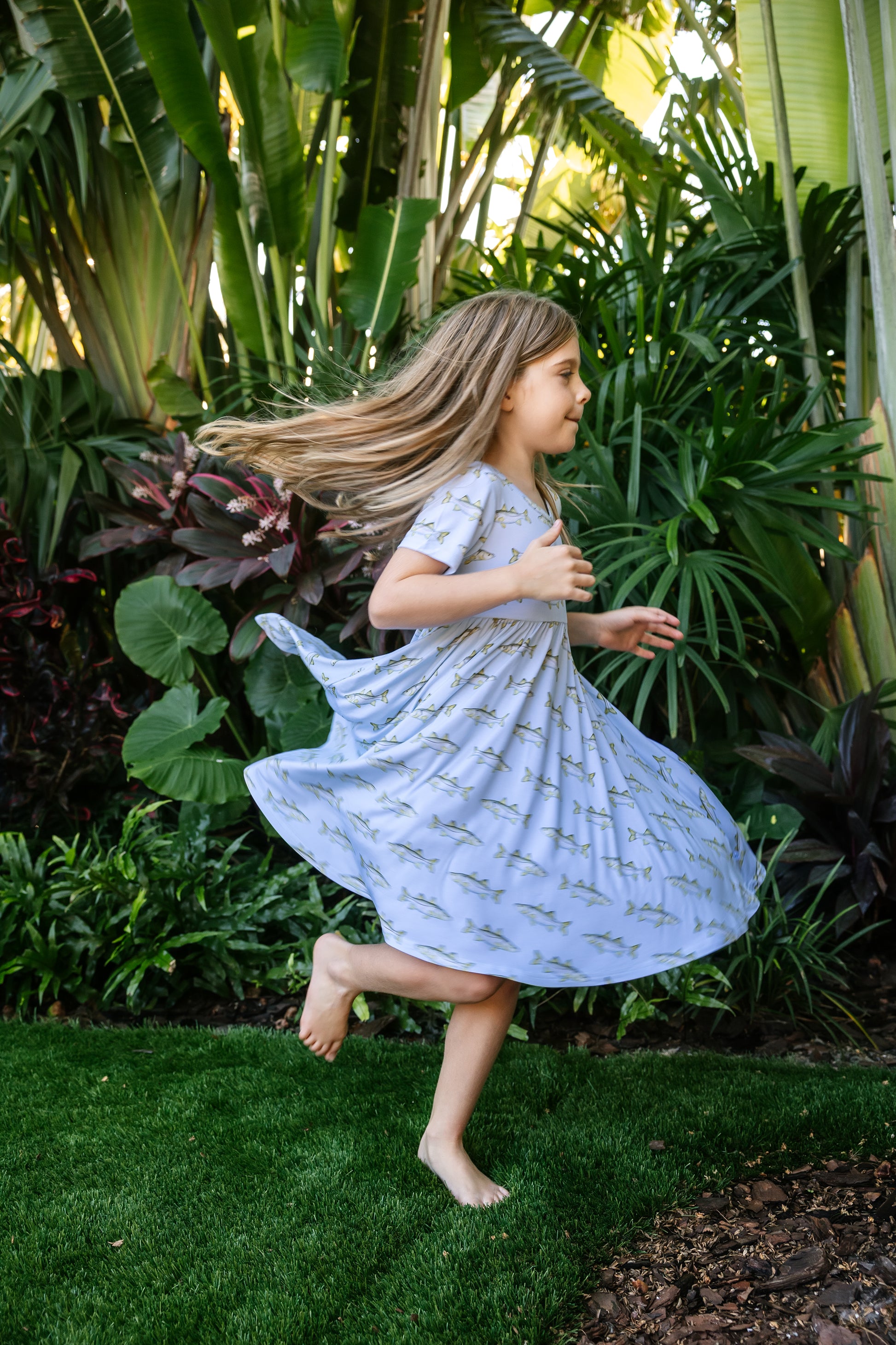 Little girl twirling in snook seaside dress