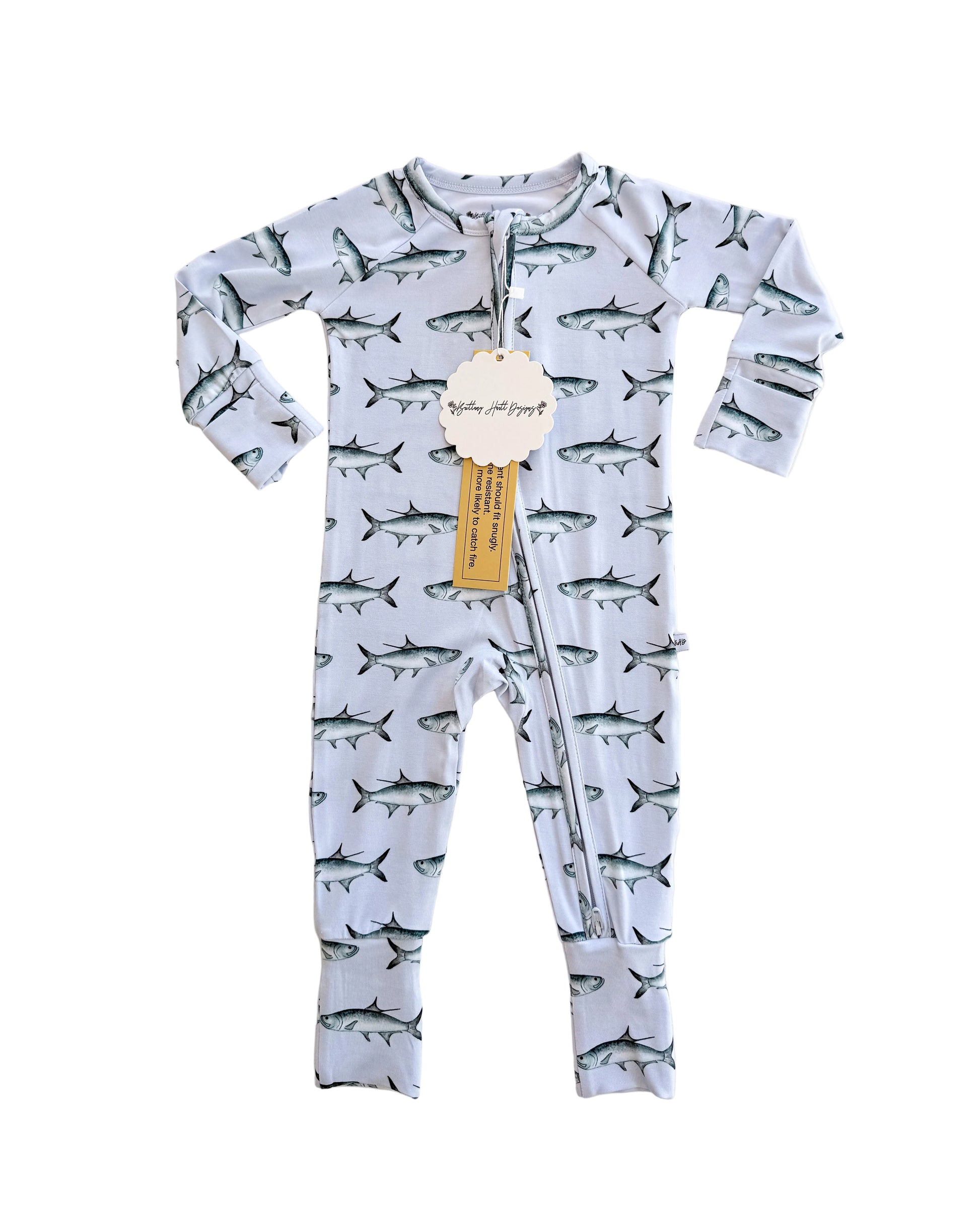 Baby onesie with tarpon pattern on a light blue background