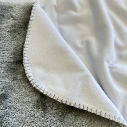 plain white stock photo of minky blanket with grey sherpa backing